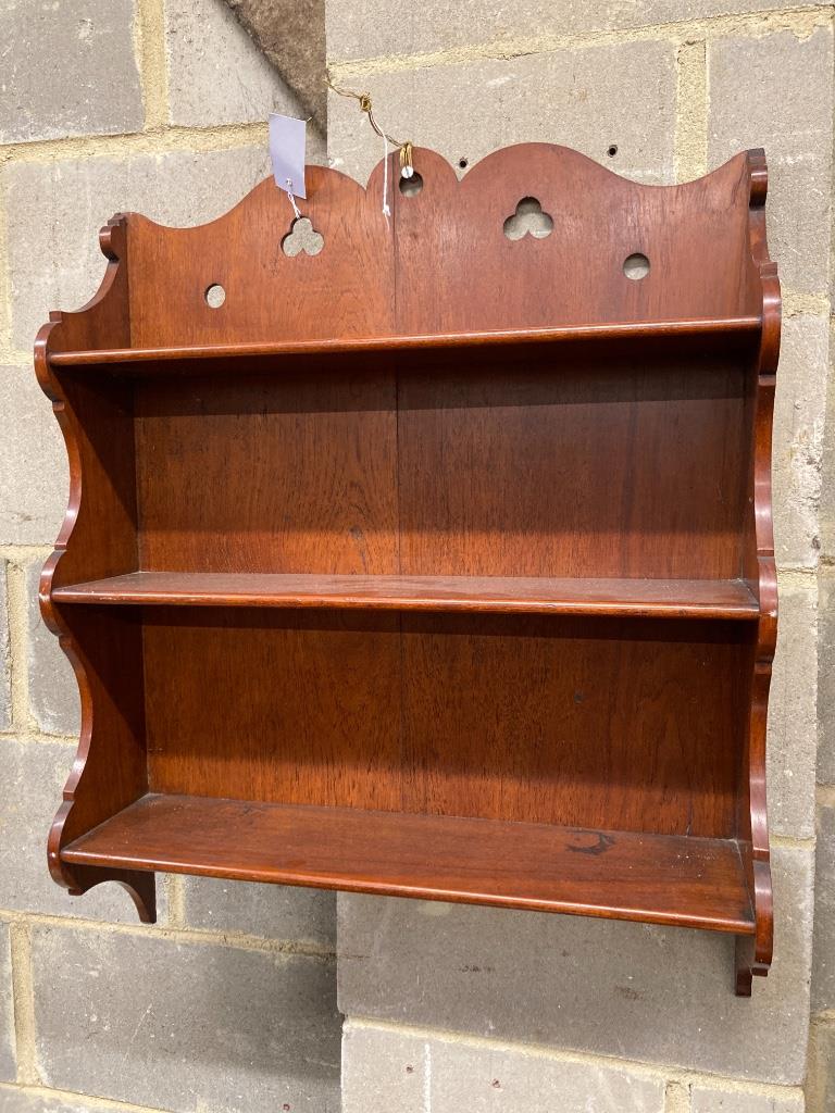 A Victorian oak wall shelf, width 60cm